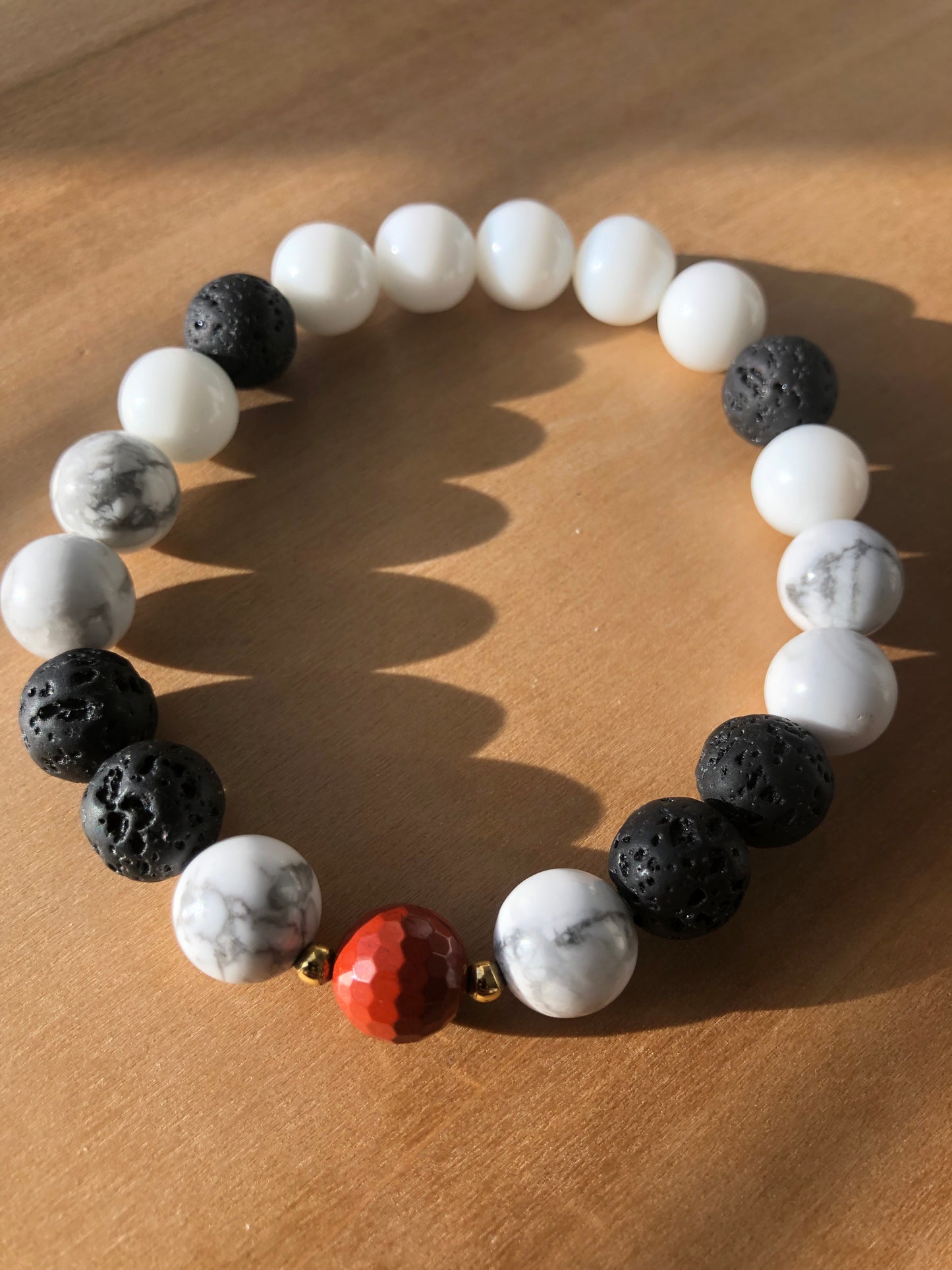 "Lightning Count" - Lava Stone, Howlite, White Jade, Faceted Red Jasper with Gold Brass Spacer Bead