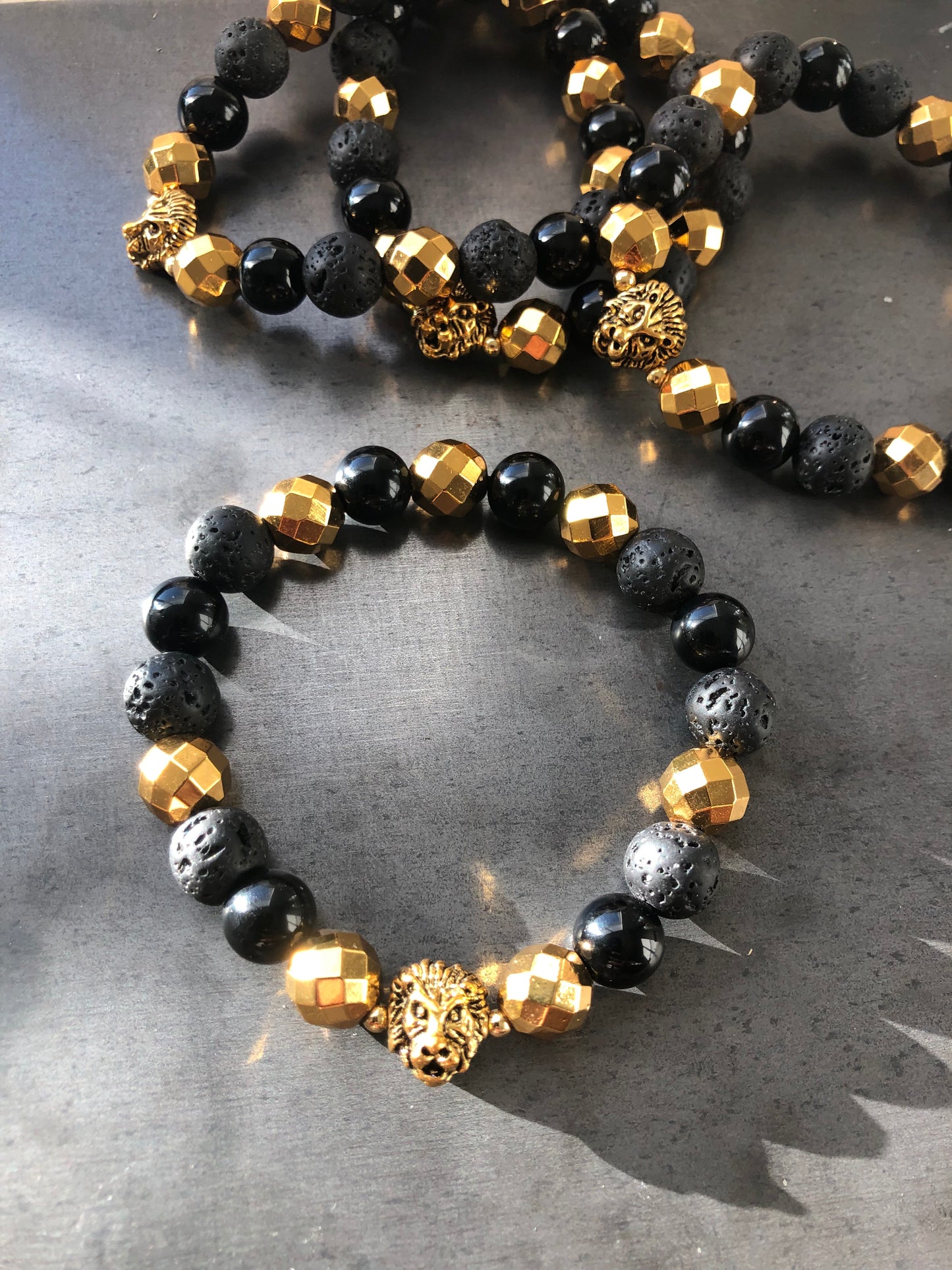 "Forza Et Honorum" - Onyx, Lava Stone, Hematite with Spacers and Lion Head Bead Stretch Bracelet