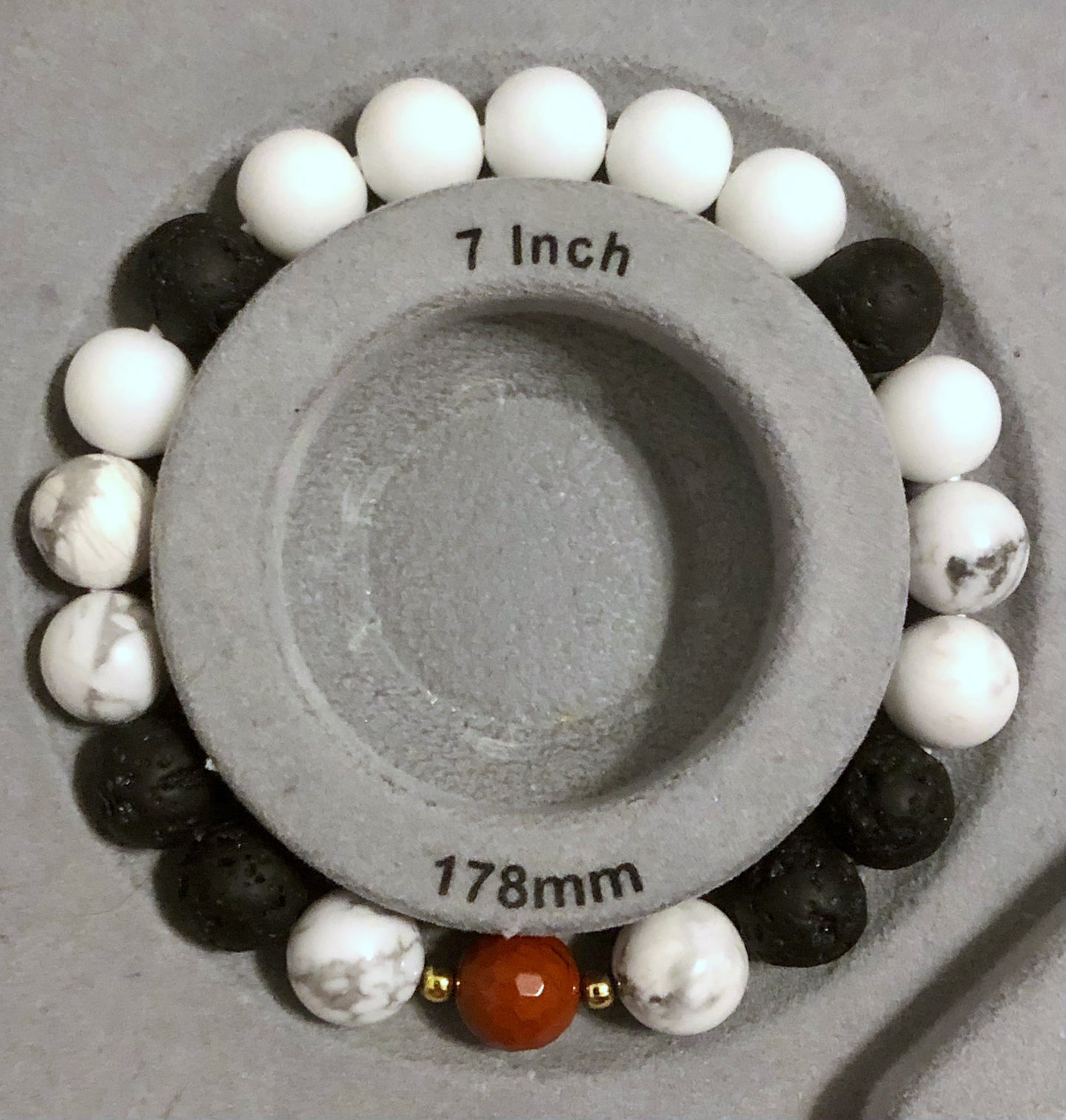 "Lightning Count" - Lava Stone, Howlite, White Jade, Faceted Red Jasper with Gold Brass Spacer Bead
