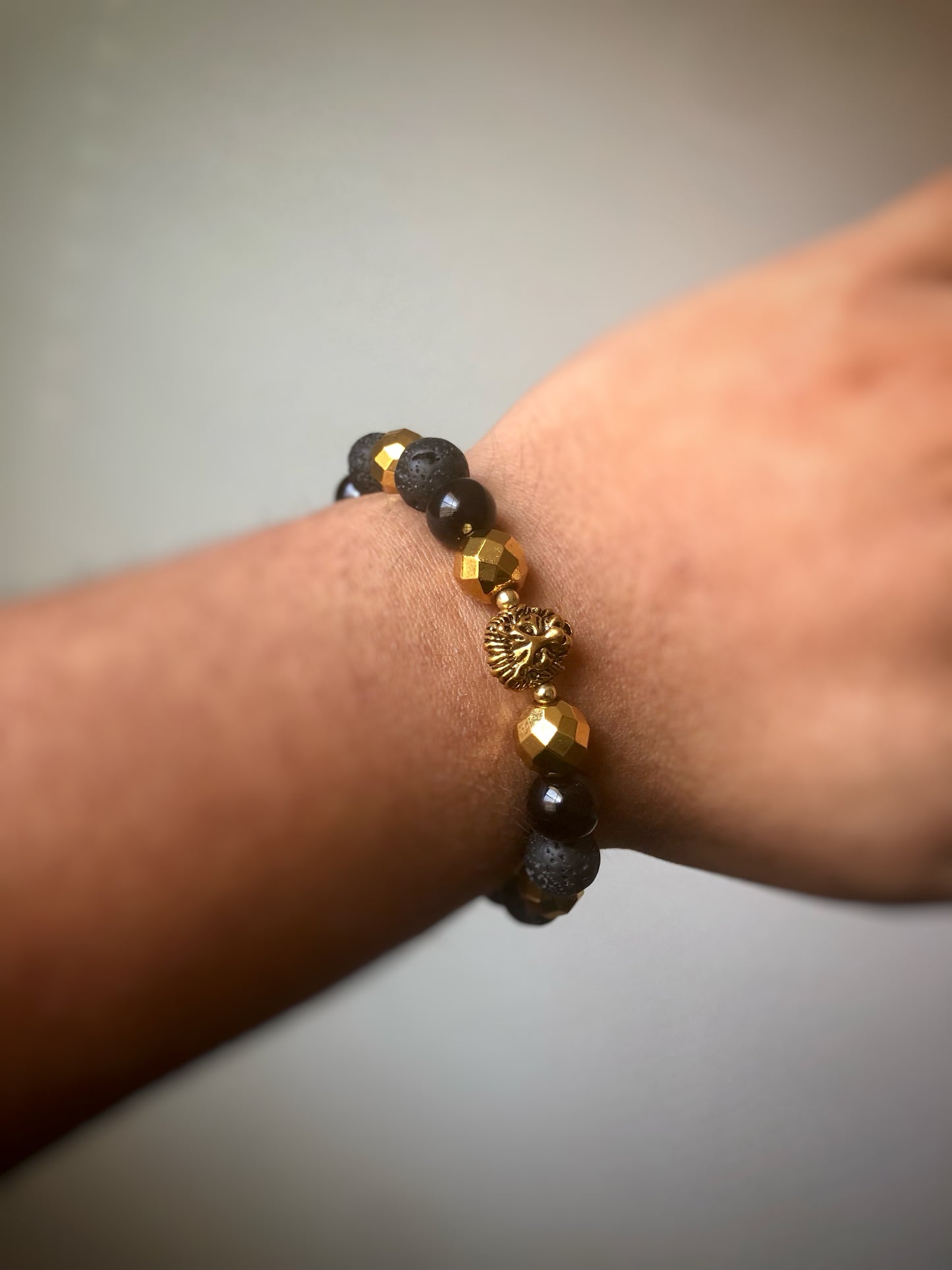 "Forza Et Honorum" - Onyx, Lava Stone, Hematite with Spacers and Lion Head Bead Stretch Bracelet